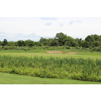A wetland gobbles up poor shots to the fifth green at Ravines Golf Club in Saugatuck, Michigan.