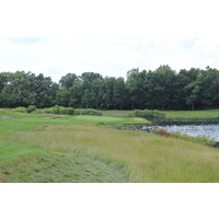Stay left to avoid Hawk Lake on the par-3 17th hole at Hawk Hollow Golf Club in Bath, Michigan.